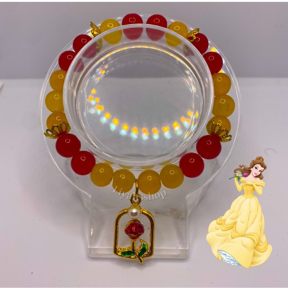 Character themed beaded bracelet with a rose charm